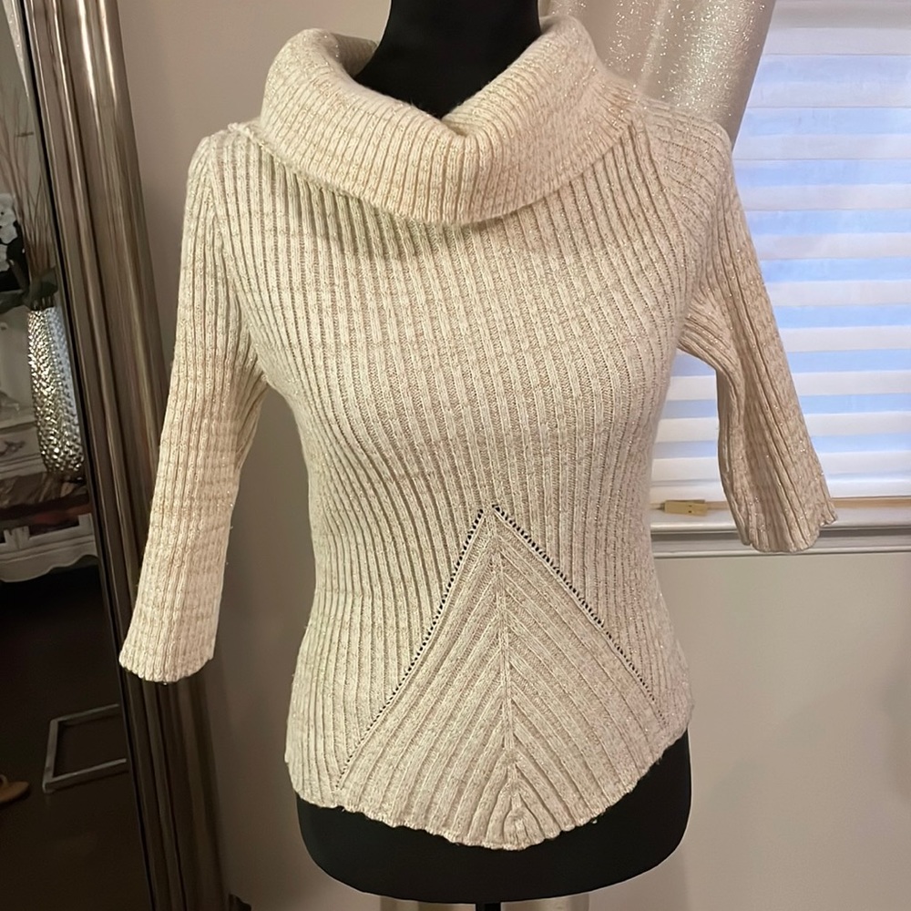 Cream and gold sweater with 3/4 sleeves.